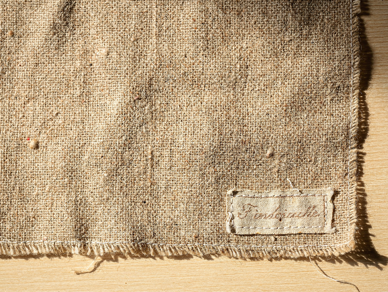 Detailed cross-weave texture of natural unbleached flax linen